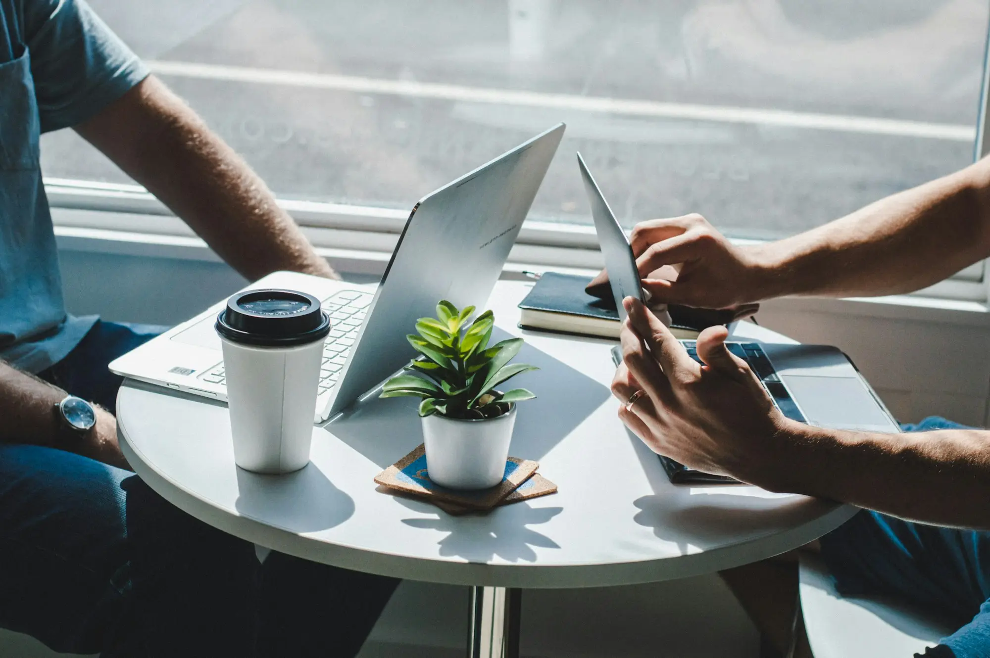 Business owner talking through options over coffee with an adviser
