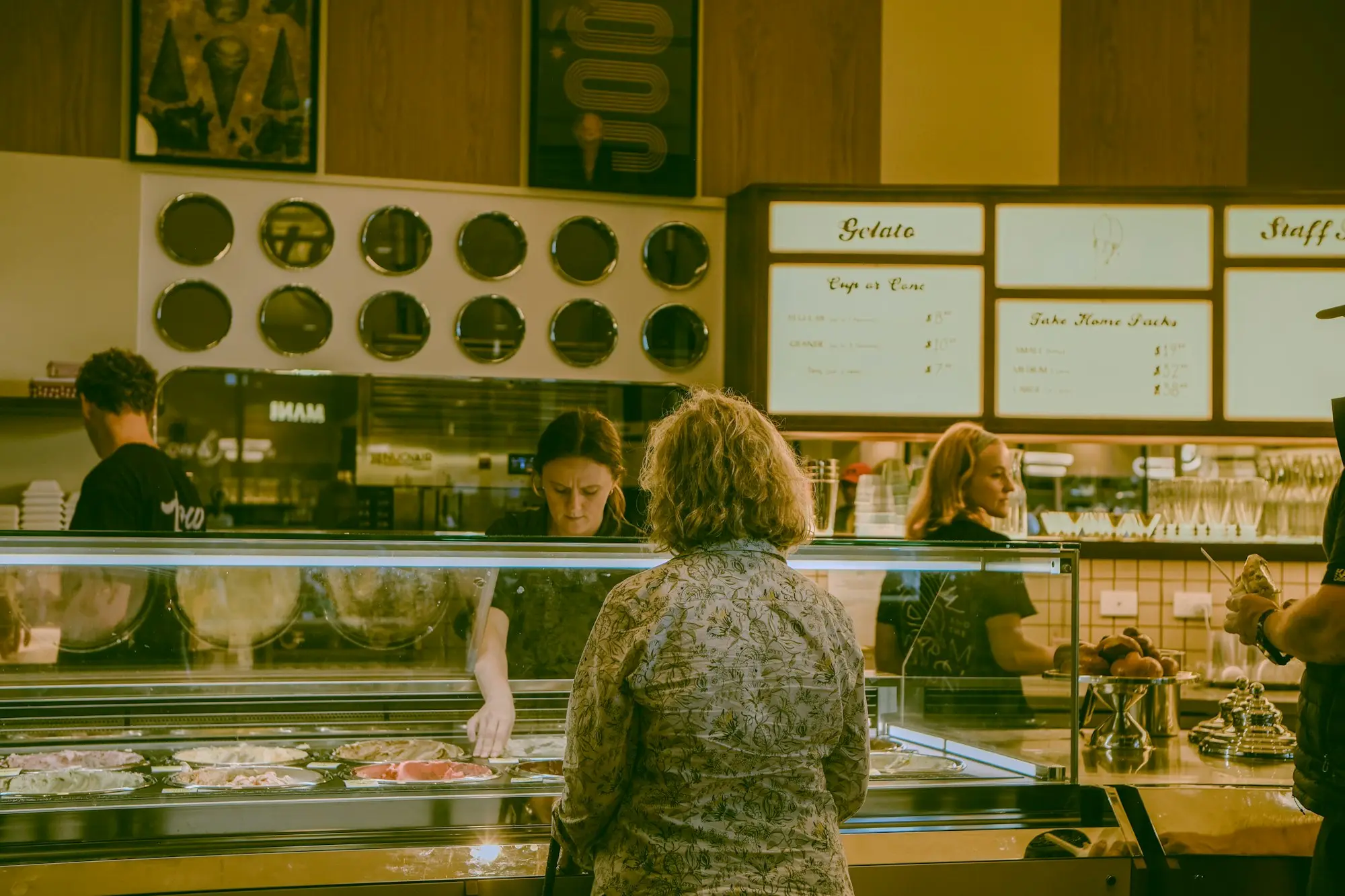Retail shop owner serving a customer at the till in an Adelaide boutique