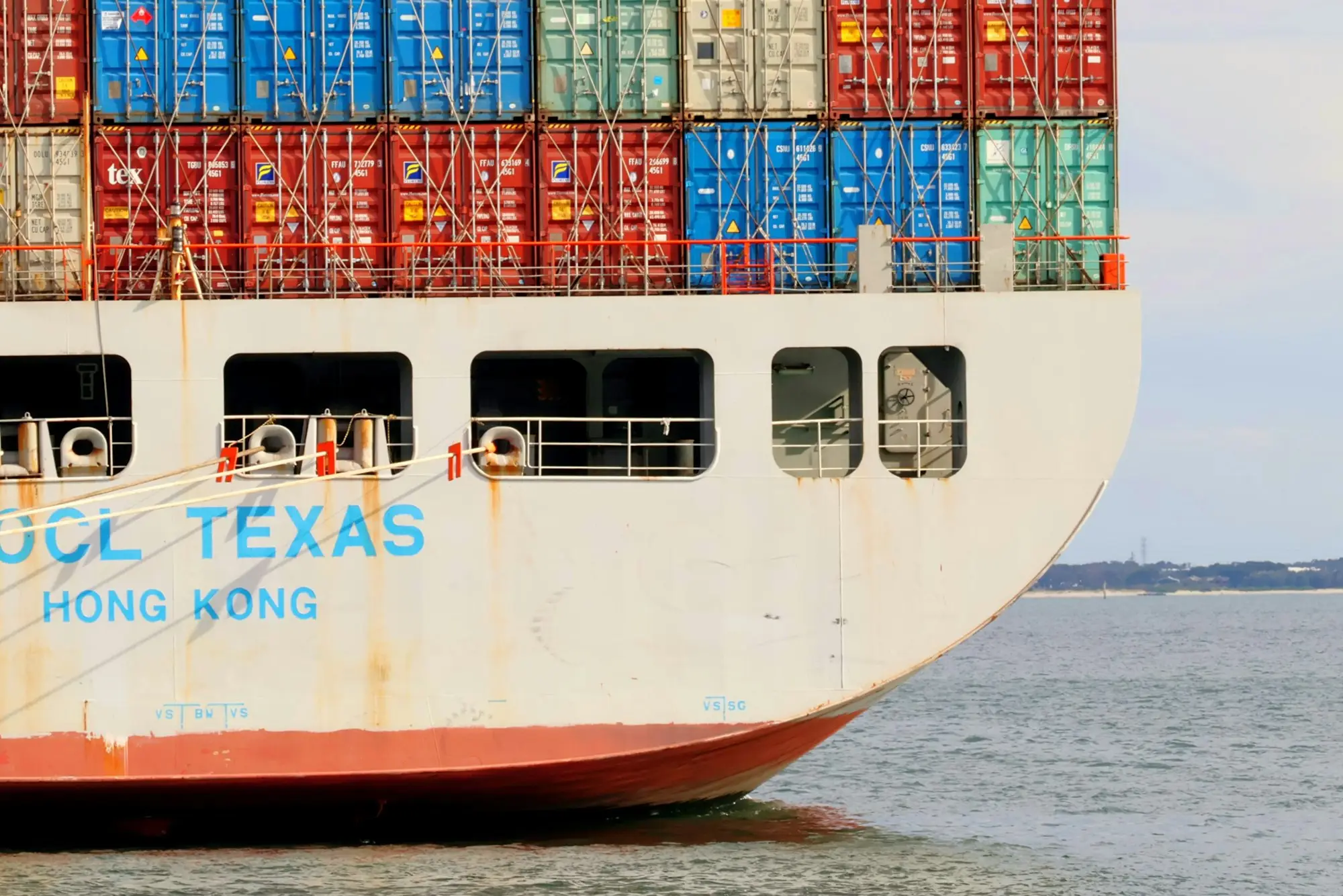 Stacked shipping containers and cranes at Port Botany in Sydney