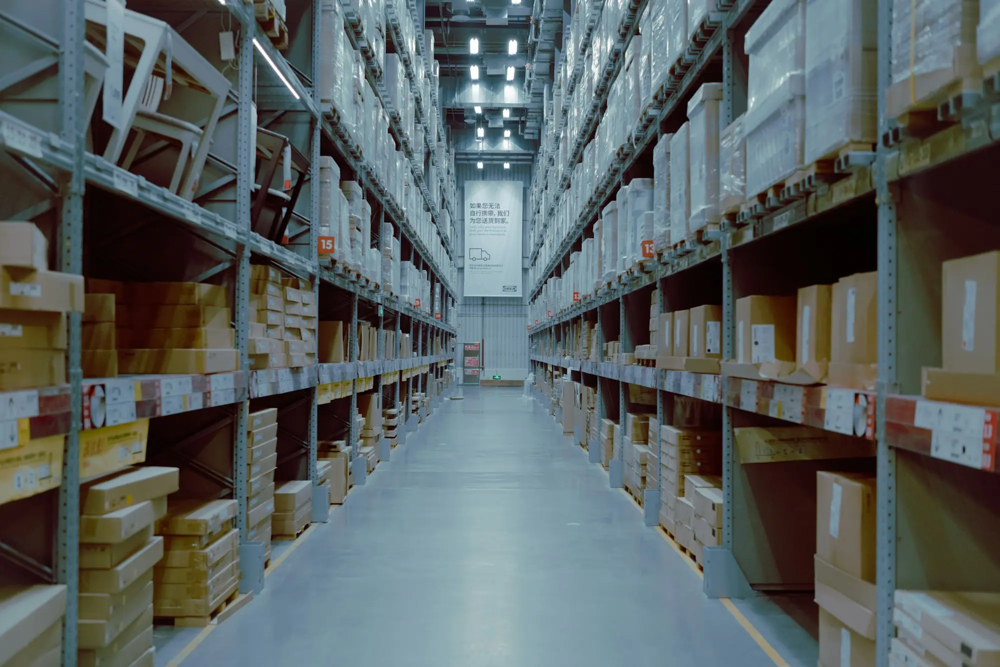 Rows of stocked warehouse shelving with a forklift in a Sydney distribution centre